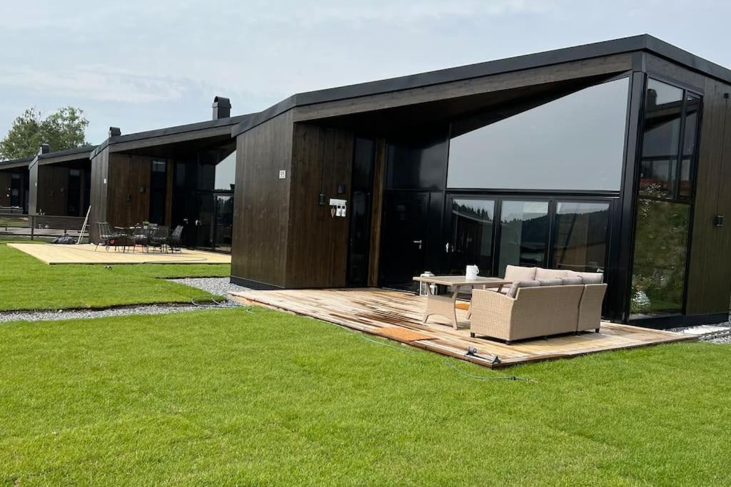 Nes Municipality House | Attraktiv & smart funkishytte på Nes Strandhager.