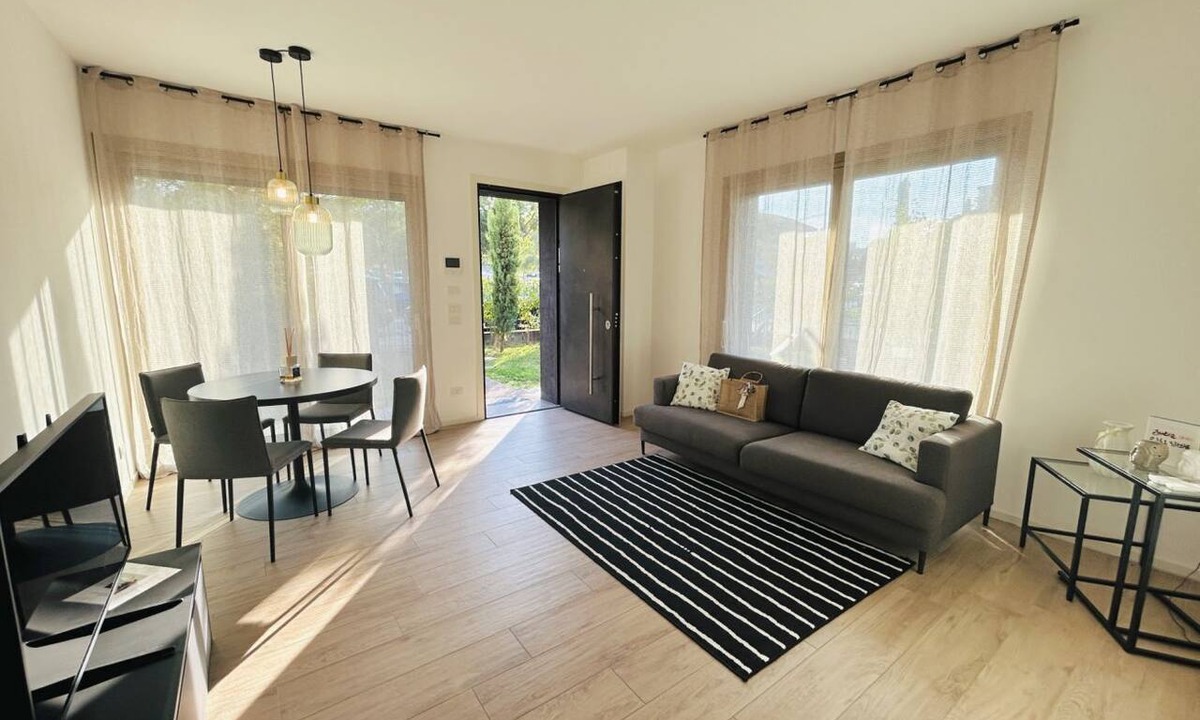 Alba Apartment | Elegant newly built apartment, located on the ground floor. Internally it consists of entrance on living room and kitchenette, double bedroom, twin bedroom, two bathrooms with shower. To complete the property large private garden and double outdoor parki