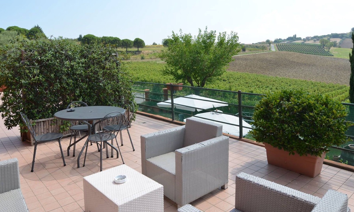 Passano Apartment | Garden-View Apartment in Coriano Italy with Swimming Pool