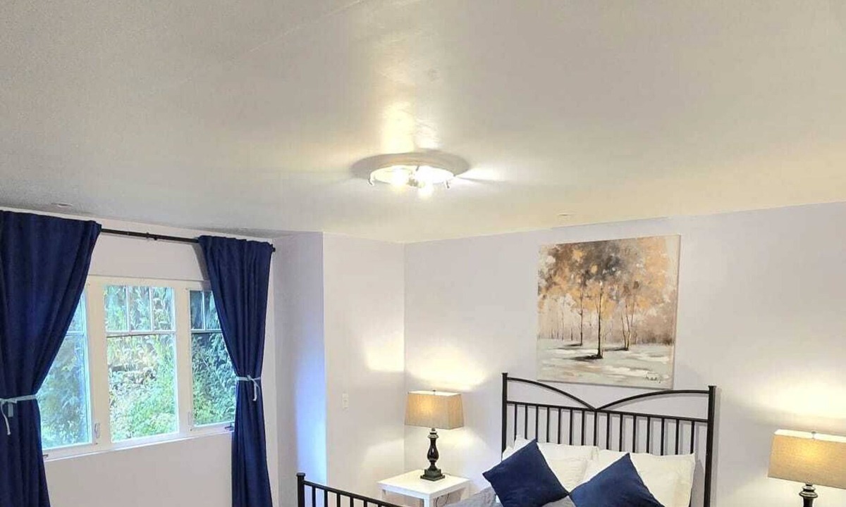 Upper Lonsdale House | Master bedroom with en-suite bathroom, and a shared kitchen and living room