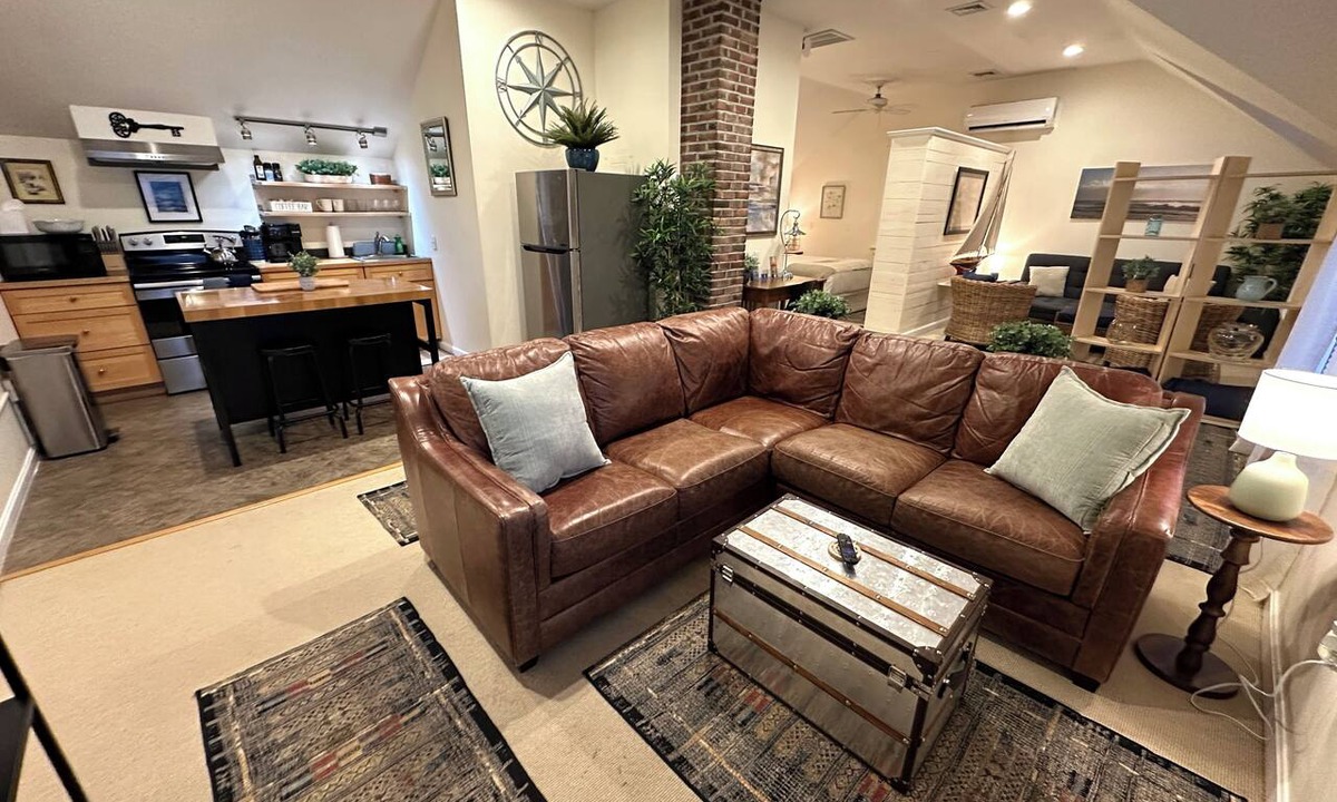 Yachting Village Apartment | Unwind in harbor luxury at this sophisticated studio in Newport's Yachting Village! Cozy queen bed + pull-out sofa bed, fully stocked kitchen, huge deck with sunset harbor views, mini-split AC, TV, off-street parking. Steps to marinas, Thames Street