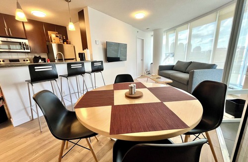Crosstown Apartment | 1 bedroom + Sofabed, Private 500sqft sun deck, EV Parking w/Pool, Sauna, Hot Tub
