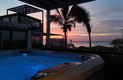El Sargento House | 3 bedroom, 3 bath premium stylish shipping container home. Game room w/darts, shuffleboard, video game cabinet, Infinity game table, new 8 person hot tub, multiple decks w/firepits, fast Wifi (250 mb+)w/Starlink backup. Free use of two SUPs.