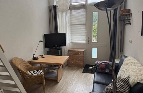 Oudorp Apartment | Apartment in Alkmaar, in the district of Oudorp with a polder landscape with windmills,