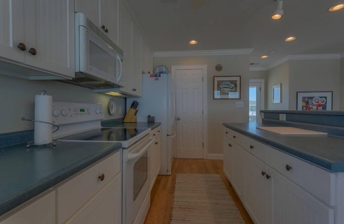 Holden Beach House | Bee Holden - Enjoy the beautiful Atlantic ocean from the deck while relaxing on the porch swing