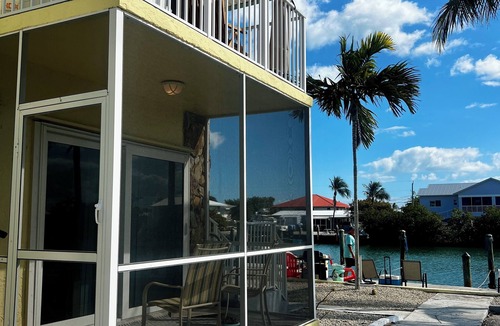 Marathon Condo | Coco Plum Beach Paradise: Water Views, Heated Pool, and Boat Slip.