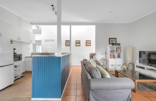 Broulee Apartment | Cosy Getaway with Fireplace and Spacious Backyard