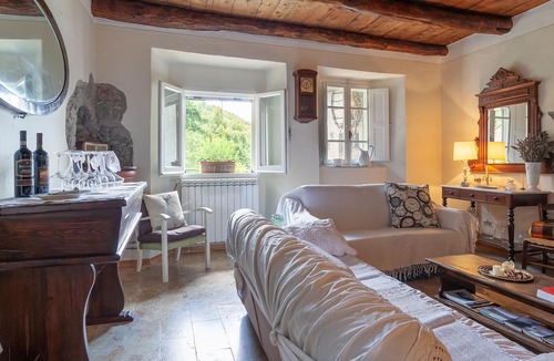Piazza al Serchio House | Cozy cottage with fireplace and stunning views.