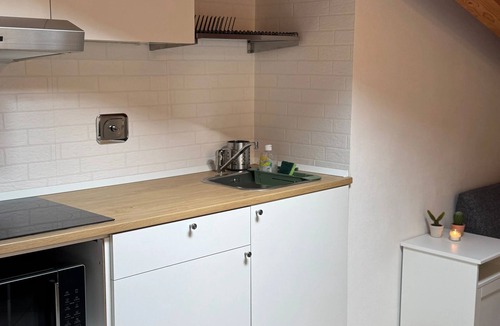 Casalecchio di Reno Apartment | Delightful and romantic attic room in Bologna just a stone's throw from the Unipol Arena