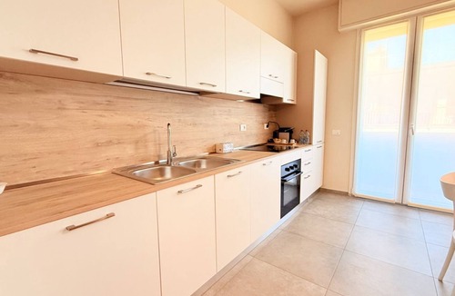 Prato Apartment | Discover Apartment Dante, an elegant residence located in a quiet area just 15 minutes from Florence. Tastefully furnished with high-end finishes, this apartment is designed for those seeking a refined environment that meets every need.Perfect for famili