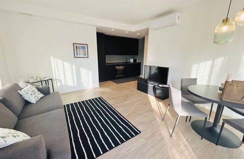 Alba Apartment | Elegant newly built apartment, located on the ground floor. Internally it consists of entrance on living room and kitchenette, double bedroom, twin bedroom, two bathrooms with shower. To complete the property large private garden and double outdoor parki