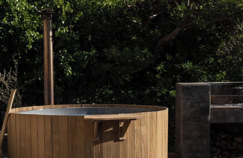 Stellenbosch Apartment | Enjoy the privacy of your own wood fired hot-tub, barbecue & breathtaking views.
