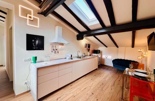 Historic Center Apartment | Harbor House. Relaxed and fun atmosphere with a view of the rooftops of Bologna.