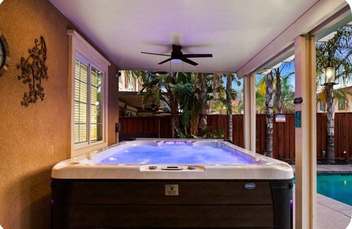 Lake Elsinore House | Kimberly's Chandelier Château Salt Pool & XL Hot Tub