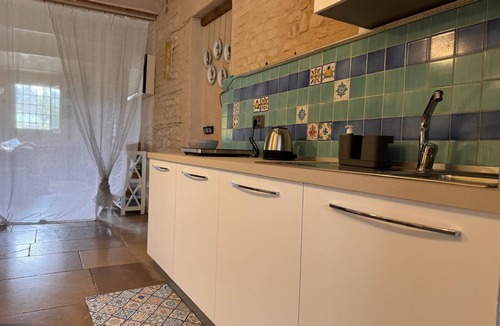 Albinea Apartment | La Maison Deux, an old farmhouse from the late 18th century, with Provençal features.