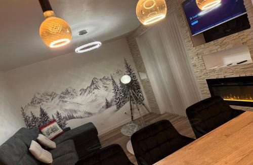 Albertville Apartment | loyika , résidence avec caméra et digicode possibilité location voiture Mercedes ,garage ,T3 climatisation ,cheminée, Netflix, petit déjeuner offert, boisson rafraîchissante pour la bienvenue, repas du soir fondue, raclette , barbecue sur demande