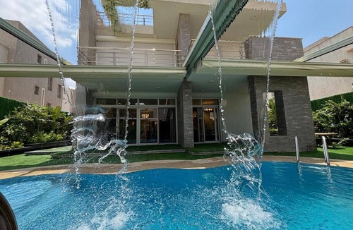 New Cairo Villa | Luxury 7-Bedroom Smart House with Resort-Style Heated Pool + Waterfall + Garden