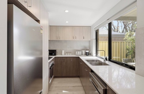 Bentley House | Newly built two-storey townhouse in the heart of Bentley — ideal for families, groups & corporate stays. Modern interiors, gourmet kitchen, private alfresco & a Nespresso on us.