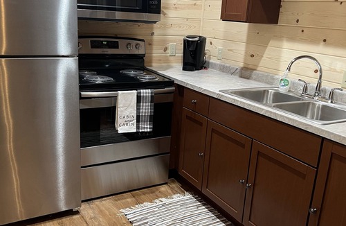 Logan Cabin | Secluded and close to all attractions. No cleaning fees!