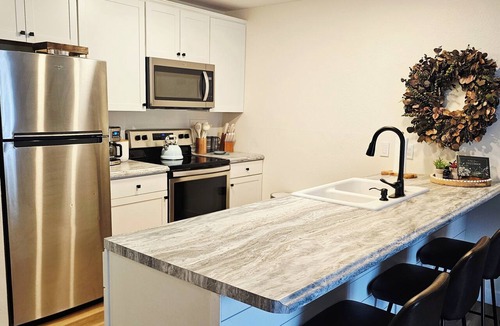 Lake of the Ozarks Condo | The Getaway! Heated Pool, Lake Views, Fishing & minutes from Dining & Nightlife.