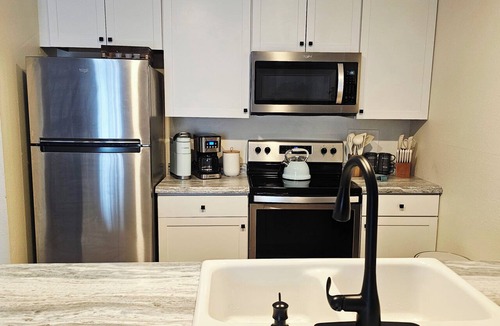 Lake of the Ozarks Condo | The Getaway! Heated Pool, Lake Views, Fishing & minutes from Dining & Nightlife.