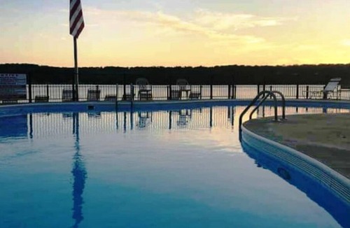 Lake of the Ozarks Condo | The Getaway! Heated Pool, Lake Views, Fishing & minutes from Dining & Nightlife.