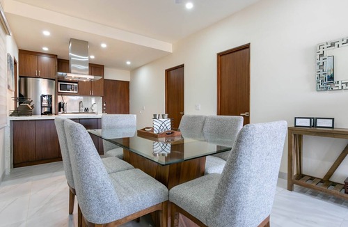 Libertad Condo | This brand-new 2-bedroom, 2-bath condo offers modern comfort with a stylish open layout and fully equipped kitchen. Enjoy a private rooftop terrace with outdoor kitchen and panoramic views—perfect for relaxing and taking in the beauty of Vista Mare.