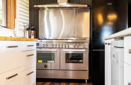 Hyams Beach House | Tree Top House with Bay Views, Short Walk to Beach, Open Fire and Sauna