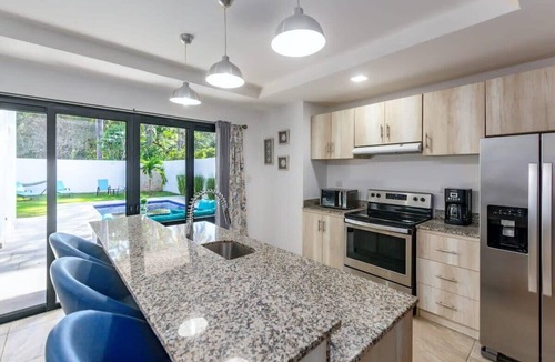 Potrero House | Ultramodern Townhome with an Inviting Coastal Design and Lush Outdoor Oasis with a Private Pool