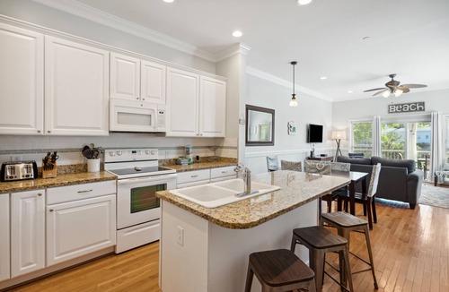 Waters Edge House | Water's Edge 103 - Bright 3BR/3BA Townhome - Pool - Fishing Dock