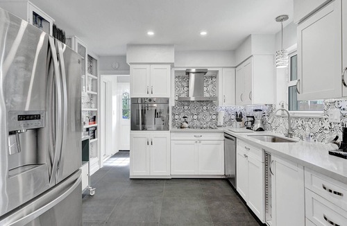 Coral Ridge Isles House | Waterfront 2BR Home Heated Pool BBQ Parking!