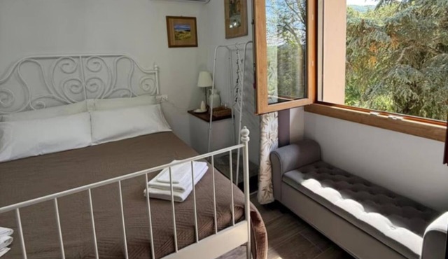 Charming Guest Room in Villa Casavecchia with City, Garden, and Mountain Views