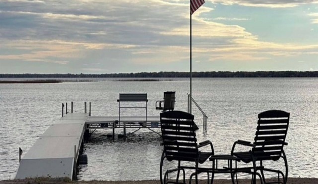 Cozy lakefront home rests on Shawano Lake - swimming, fishing, boating, dock.