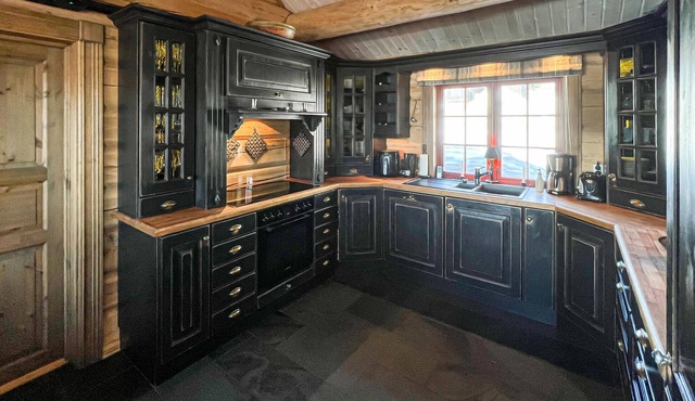 Experience peace and nature in a holiday home with mountain views and sauna.