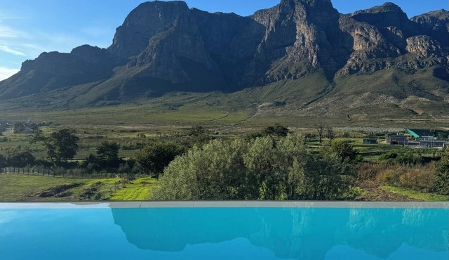 Farm stay in the Cape Winelands with views for days.