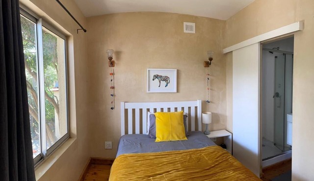 Garden Cottage with Hot Tub in beautiful eco village - 5 mins walk to the beach