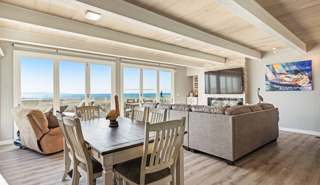 Gorgeous waterfront home with a private hot tub, gas fireplace, & beach access