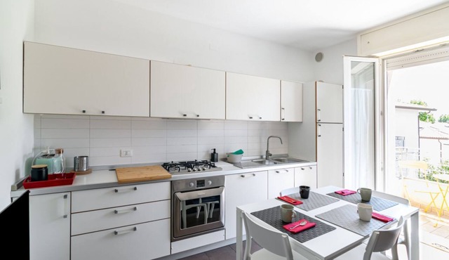 GuestHost - 100 meters from the sea and 2 km from the fair, our apartment is located on the second and last floor of a building with a lift (NOT suitable for disabled people). There are two steps at the entrance.In 45 m2 of space it comfortably accommoda