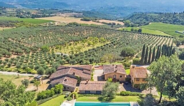 Historic farmhouse among Tuscan olive trees