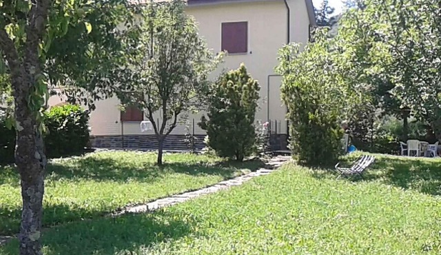 Holiday home with panoramic garden near the lake Suviana