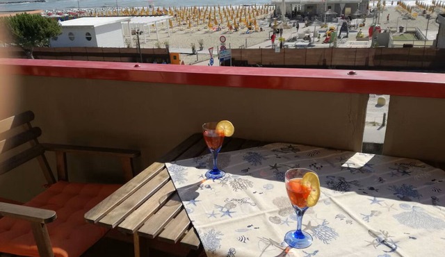House on the beach with an umbrella and 2 sunbeds , large balcony with sea view,
