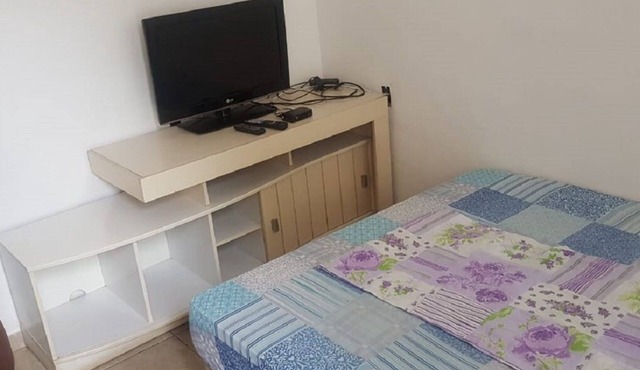 house with 2 rooms, bathroom, service area and garage