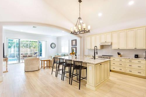Imola Vacation Rental - Remodeled Pool Home Minutes from Vanderbilt Beach! Family-Friendly Retreat with 4 BR 4 BA and Private Screened Pool!