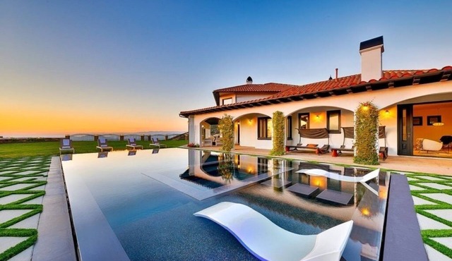 Luxurious 8-bedroom malibu Skyview estate With endless Stunning mountain views.