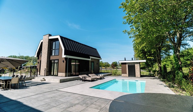 Luxury 10-person villa in Waarland with 5 bedrooms, private indoor pool, hot tub, and plenty of peace, space, and comfort.