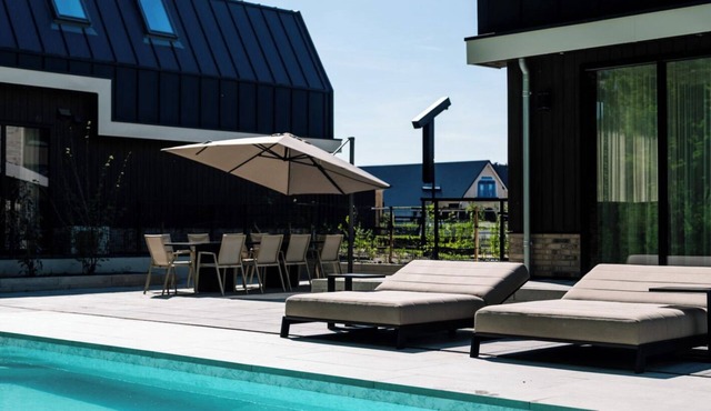 Luxury 12-person villa in Waarland with 6 bedrooms, private indoor pool, hot tub, and plenty of peace, space, and comfort.