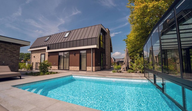 Luxury 16-person villa in Waarland with 8 bedrooms, a private indoor pool, a hot tub, and plenty of peace, space, and comfort for the entire party.