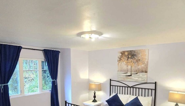 Master bedroom with en-suite bathroom, and a shared kitchen and living room