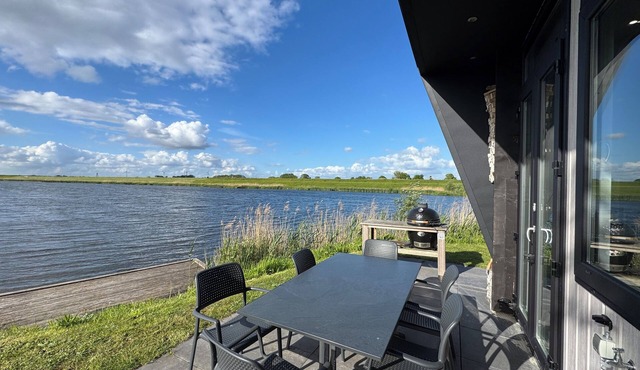 Modern chalet with exceptional lake and river views, private garden and fenced p