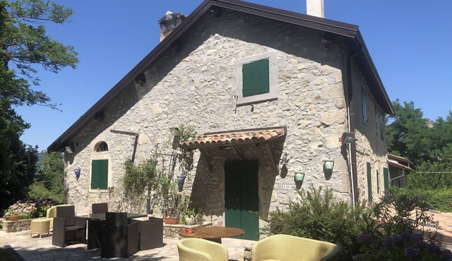 Old country house nestled in the green hills of Bologna